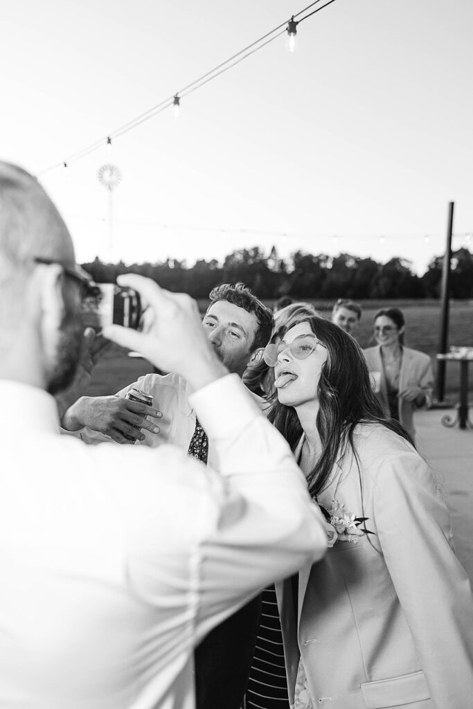 Candid moment captured during the reception with disposable cameras
