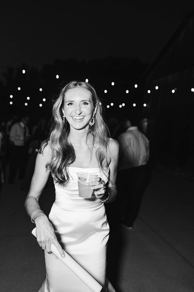 Bride laughing during wedding reception at Heritage Wedding Barns