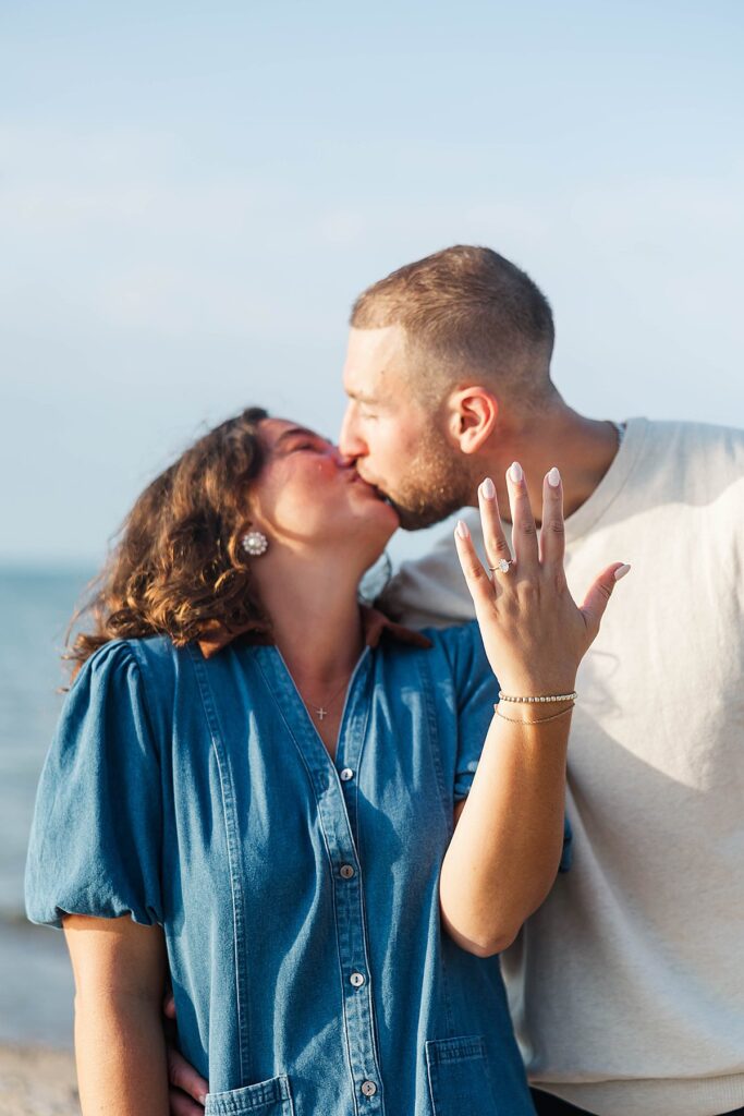 Couple embracing after a heartfelt Elk Rapids proposal