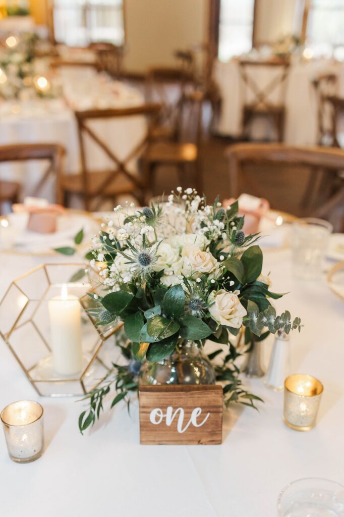 Reception table floral design at BlueBridge Events Centre wedding venue in Northern Michigan