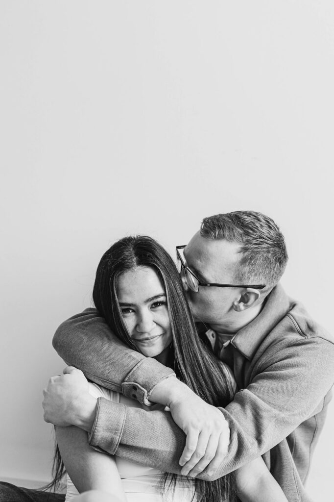 Black and white portrait of a couple hugging during a Northern Michigan engagement session