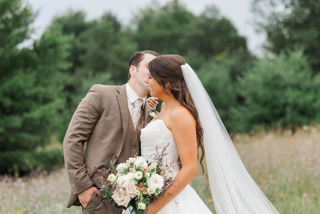 Bride and groom sharing a quiet moment during Northern Michigan wedding portraits