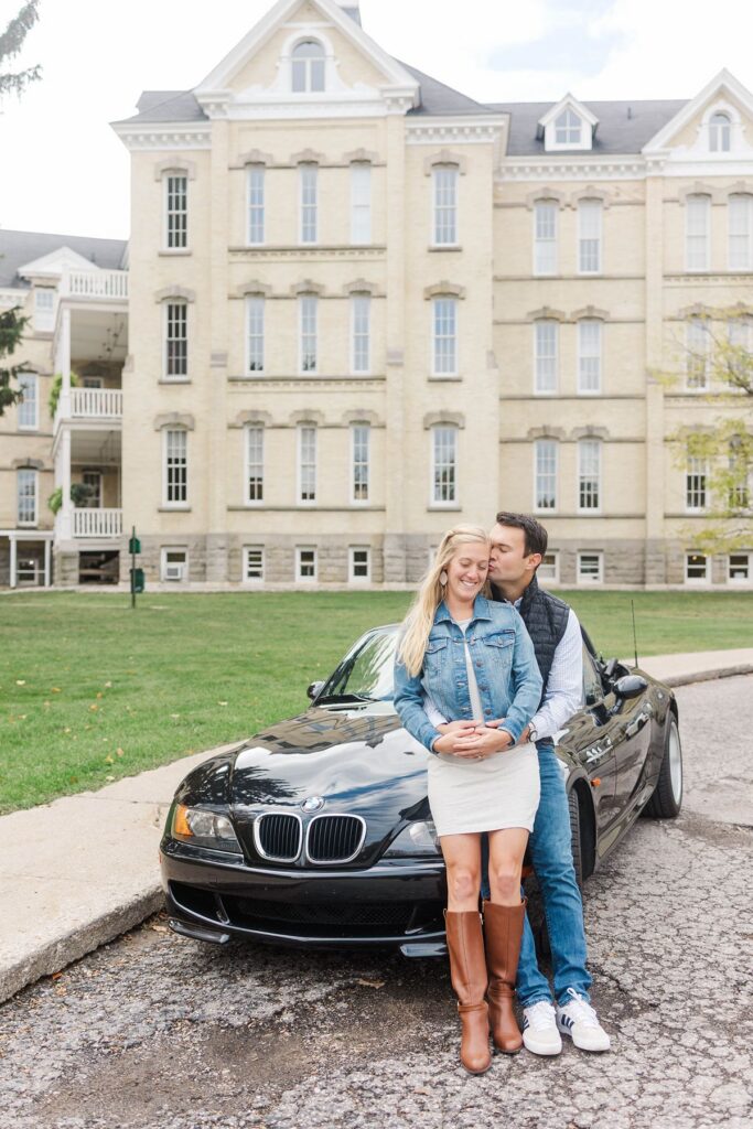 couple with BMW outside Grand Traverse Commons during a Northern Michigan portrait session