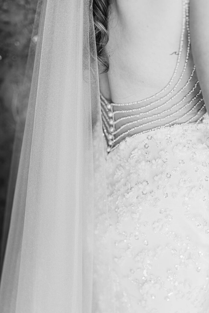 black and white close-up of wedding dress and veil details for wedding detail photos