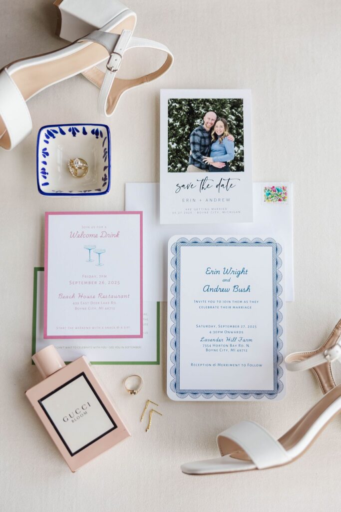 colorful wedding detail photos flat lay with stationery, perfume, and bridal accessories
