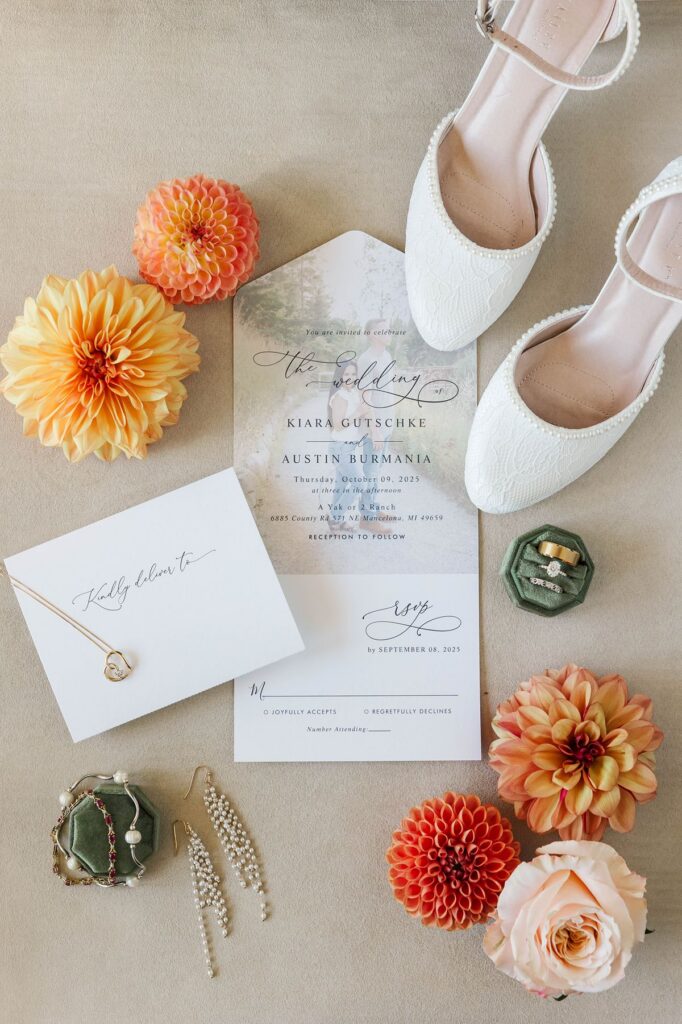 floral wedding detail photos flat lay with spring blooms and invitation styling
