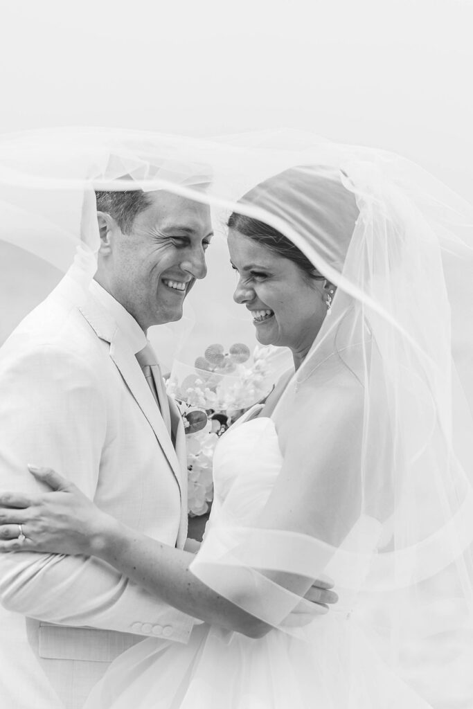 Bride and groom portraits near the water in Petoskey, Michigan