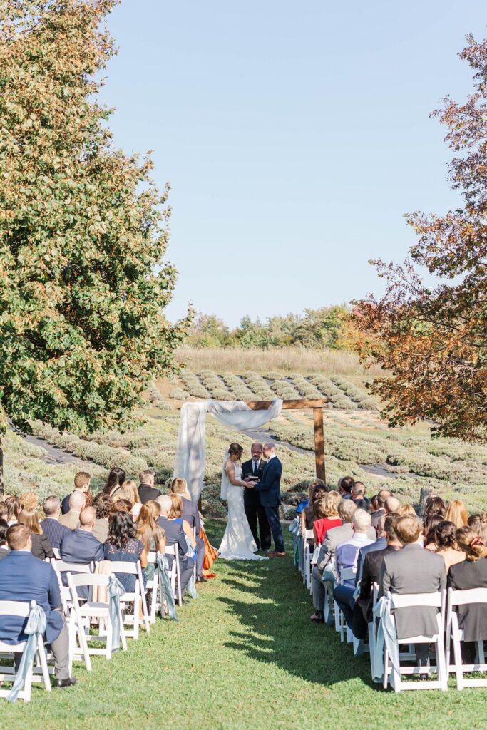 Outdoor wedding ceremony at Lavender Hill Farm overlooking the lavender fields