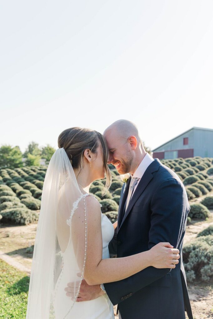 Bride and groom sharing a quiet moment after their Lavender Hill Farm wedding ceremony