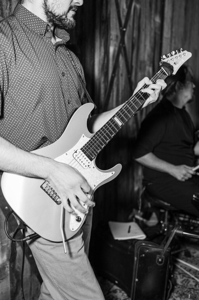 Live guitarist performing during the wedding reception at Lavender Hill Farm
