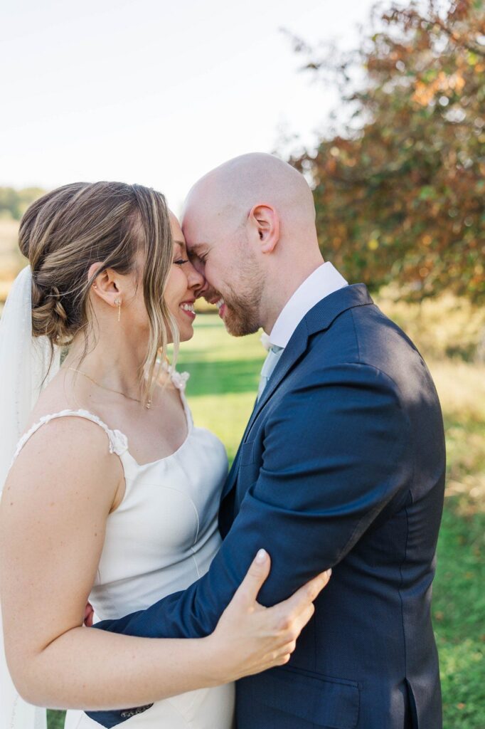 Bride and groom sharing a quiet moment after their Lavender Hill Farm wedding ceremony