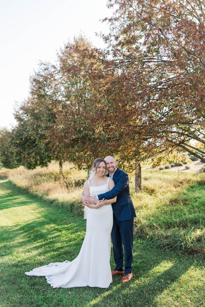 Bride and groom smiling together after their Lavender Hill Farm wedding ceremony