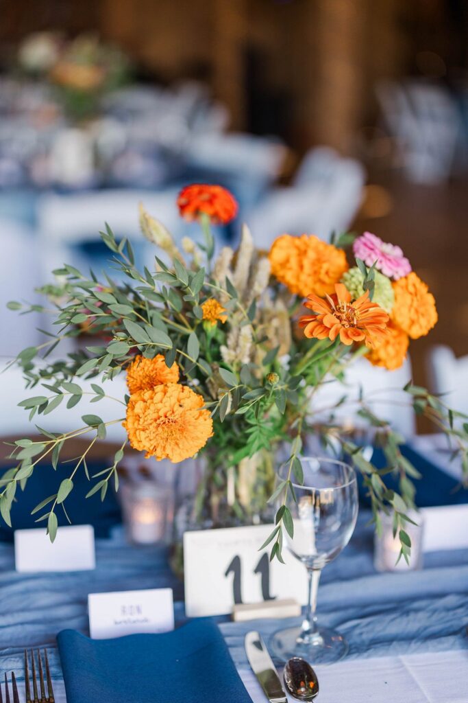 Colorful floral centerpiece at a Lavender Hill Farm wedding reception