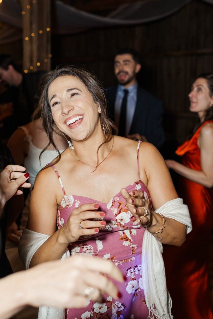 Wedding guests dancing during the reception at Lavender Hill Farm