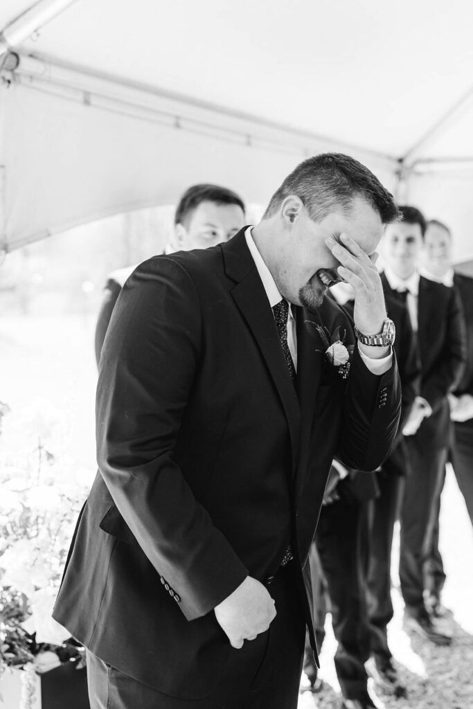 Jaxon becoming emotional as he sees Madison walking down the aisle during their Mill Pond Event Center wedding in Kalkaska, Michigan.