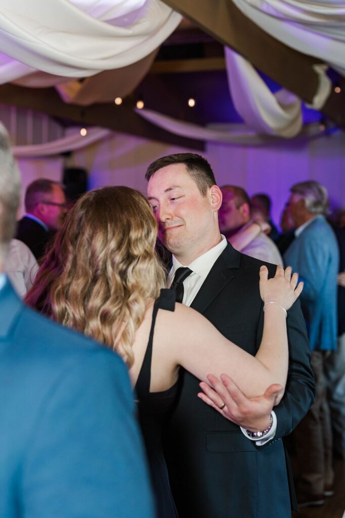 Jakob and Margaret dancing during Madison and Jaxon’s wedding reception at Mill Pond Event Center in Kalkaska, Michigan.