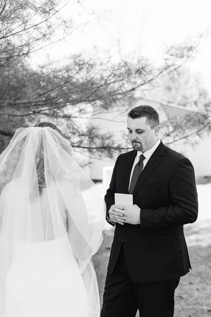 Emotional private vows shared before Madison and Jaxon's Mill Pond Event Center wedding in Kalkaska, Michigan.