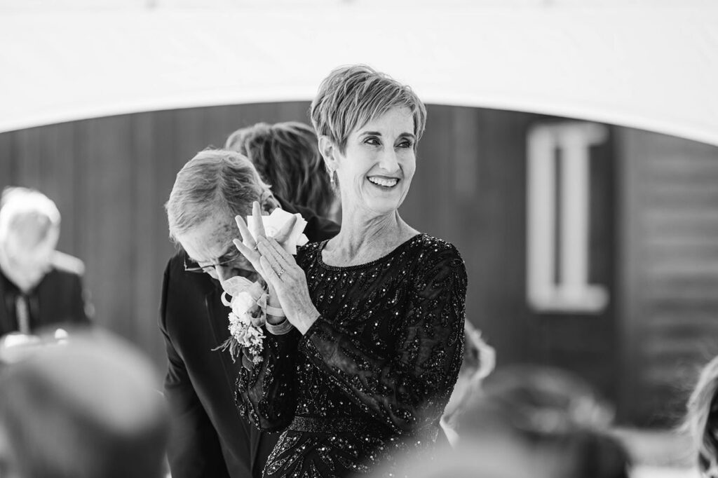 Jaxon's mom becoming emotional during the ceremony at Madison and Jaxon's Northern Michigan wedding at Mill Pond Event Center.