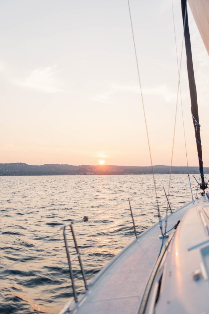 Sunset over Grand Traverse Bay during a Traverse City sailboat photos session