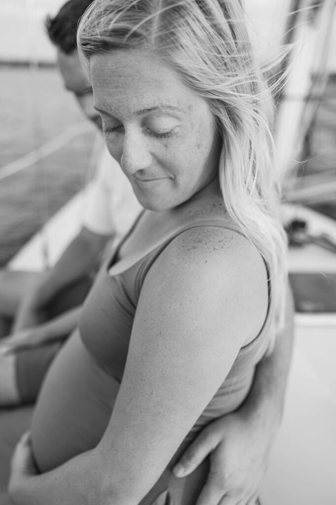 Bride from a Black Star Farms wedding during a sunset Traverse City sailboat photos session on Grand Traverse Bay