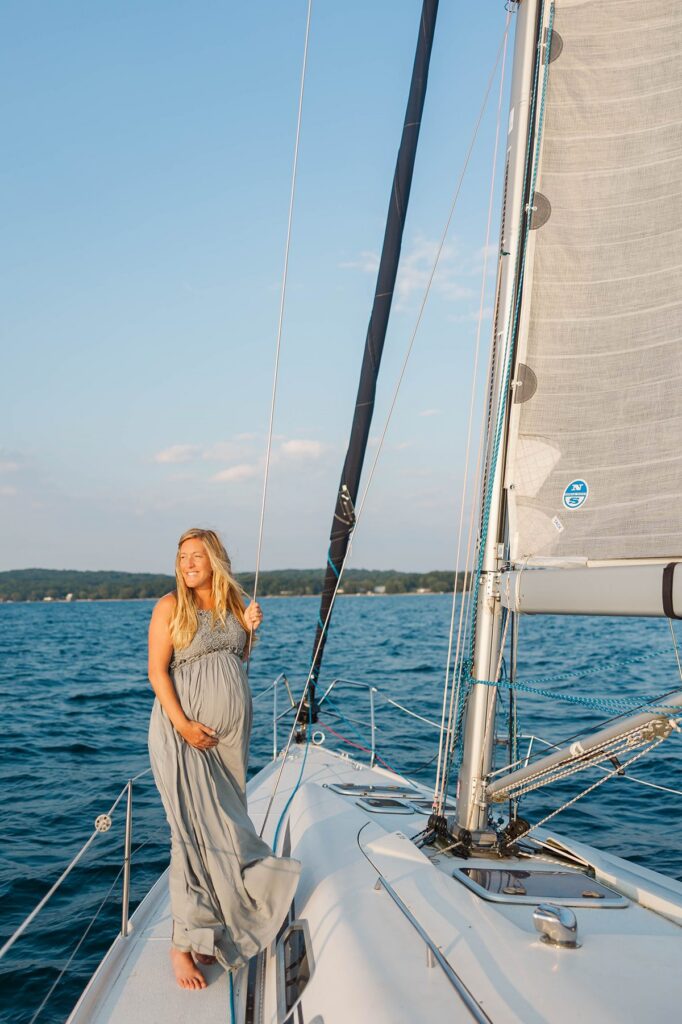 Bride from a Black Star Farms wedding during a sunset Traverse City sailboat photos session on Grand Traverse Bay