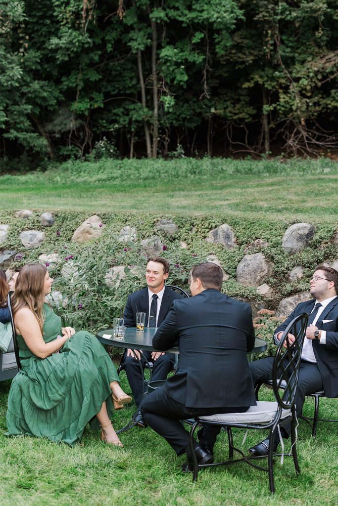Wedding guests enjoying an intimate outdoor gathering at Black Star Farms in Suttons Bay, Michigan.